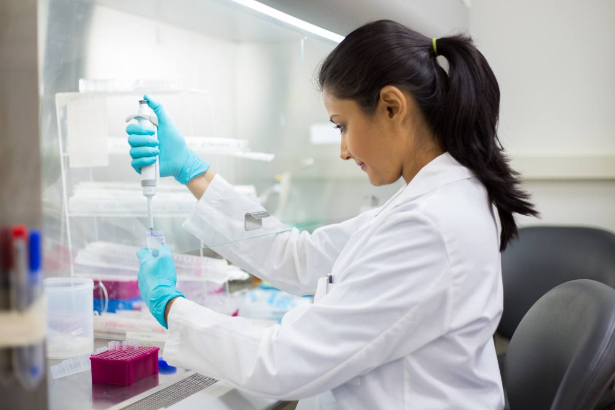 A Genique scientist preparing samples in the laboratory