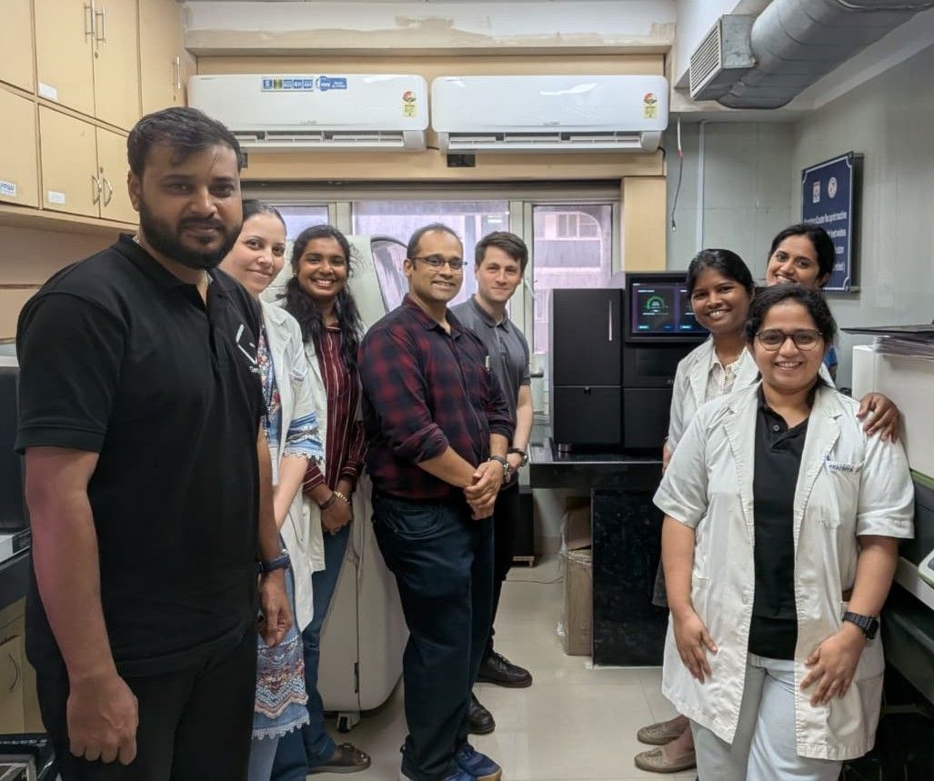 A team standing beside the newly installed AVITI24™ in the laboratory.